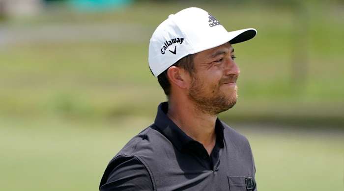 FILE - Xander Schauffele reacts to his shot out of the rough along the second fairway during the final round of the PGA Zurich Classic golf tournament at TPC Louisiana in Avondale, La., Sunday, April 24, 2022.